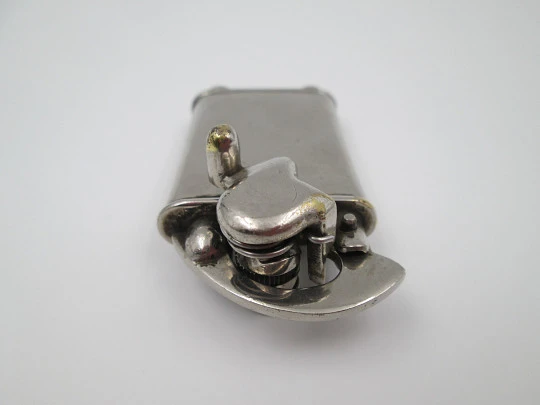 Rare lift arm petrol pocket lighter with crank started mechanism. Silver plated. 1930's