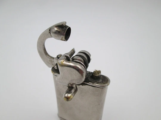 Rare lift arm petrol pocket lighter with crank started mechanism. Silver plated. 1930's