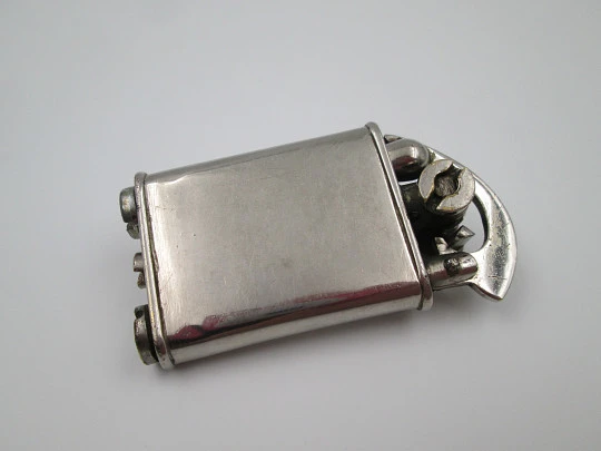 Rare lift arm petrol pocket lighter with crank started mechanism. Silver plated. 1930's