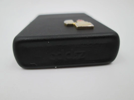 Rare Zippo petrol pocket lighter with relief motif. Black lacquer metal. USA. 1970's