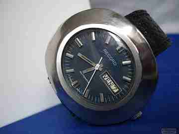 Record. Stainless steel. Automatic. 1970's. Blue dial. Oval case. Swiss
