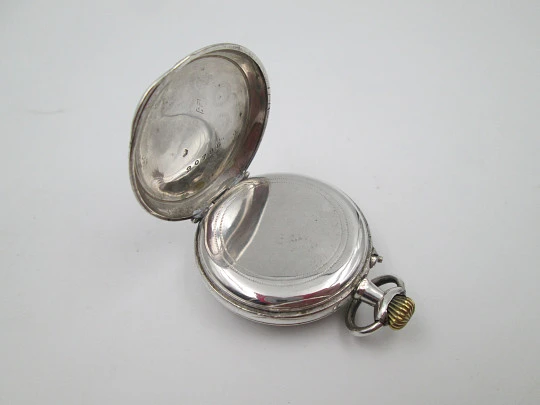 Reloj bolsillo plata ley. Esfera porcelana. Remontoir con pulsador. Motivos florales. 1890