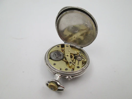 Reloj bolsillo plata ley. Esfera porcelana. Remontoir con pulsador. Motivos florales. 1890
