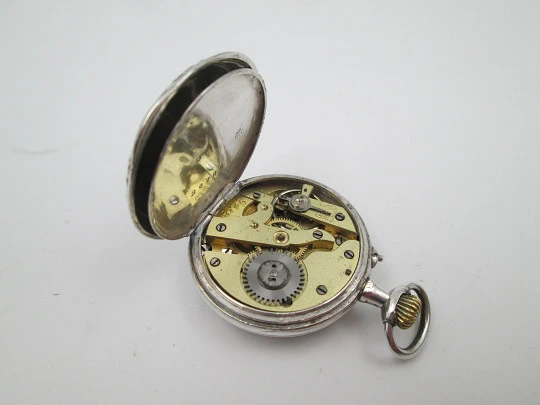 Reloj bolsillo plata ley. Esfera porcelana. Remontoir con pulsador. Motivos florales. 1890