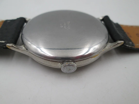 Reloj caballero Cyma Jumbo. Cuerda manual. Acero y metal plateado. Segundero. 1950