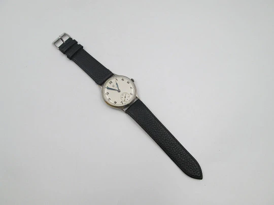 Reloj caballero Cyma Jumbo. Cuerda manual. Acero y metal plateado. Segundero. 1950