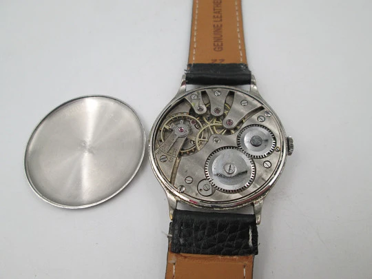 Reloj caballero Cyma Jumbo. Cuerda manual. Acero y metal plateado. Segundero. 1950