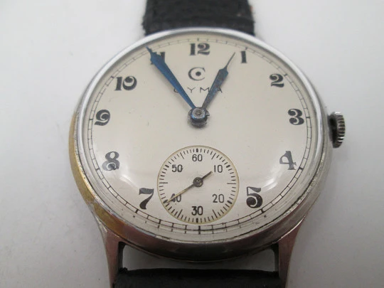 Reloj caballero Cyma Jumbo. Cuerda manual. Acero y metal plateado. Segundero. 1950