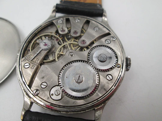 Reloj caballero Cyma Jumbo. Cuerda manual. Acero y metal plateado. Segundero. 1950