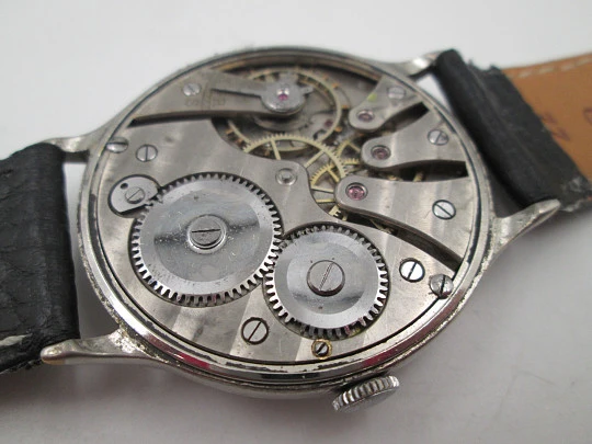 Reloj caballero Cyma Jumbo. Cuerda manual. Acero y metal plateado. Segundero. 1950