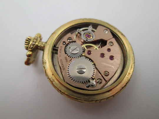 Reloj colgante mujer Exactus. Chapado oro. Esmalte color caballos. Cuerda manual. 1960