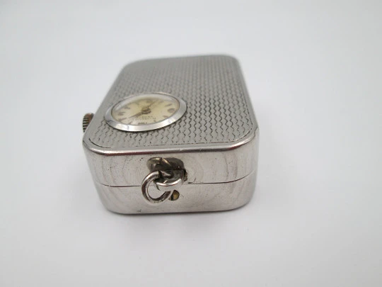 Reloj colgante R. Jaquet Genève con caja de música. Metal plateado. Cuerda manual. 1940