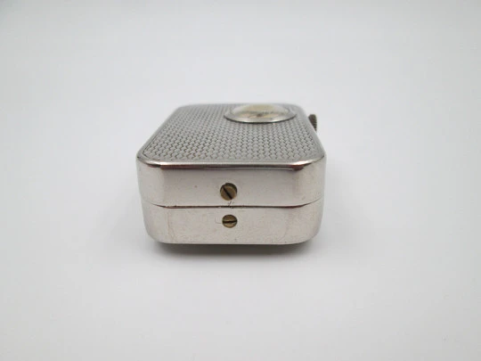 Reloj colgante R. Jaquet Genève con caja de música. Metal plateado. Cuerda manual. 1940