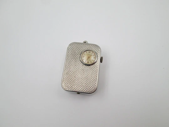Reloj colgante R. Jaquet Genève con caja de música. Metal plateado. Cuerda manual. 1940