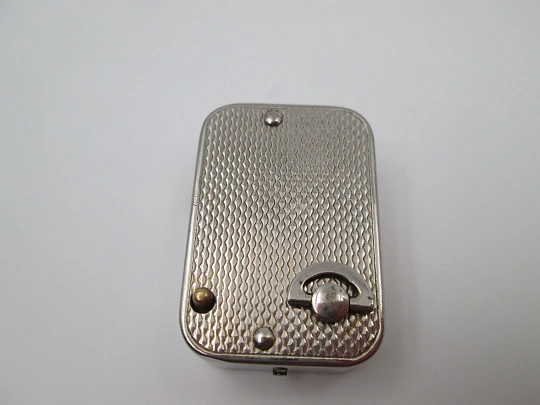 Reloj colgante R. Jaquet Genève con caja de música. Metal plateado. Cuerda manual. 1940