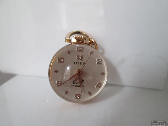 Reloj colgante Titus. Oro 18K. Suiza. 17 gemas. Bola transparente