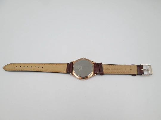 Reloj de vestir de cuarzo para caballero Seiko. Acero y chapado en oro. Calendario. 1980