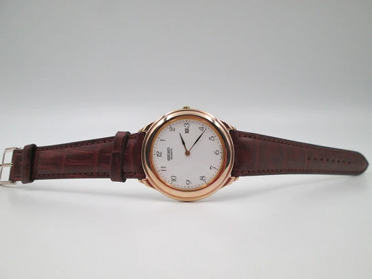 Reloj de vestir de cuarzo para caballero Seiko. Acero y chapado en oro. Calendario. 1980
