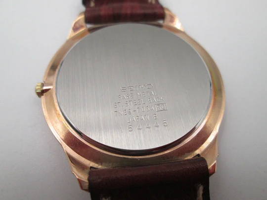 Reloj de vestir de cuarzo para caballero Seiko. Acero y chapado en oro. Calendario. 1980