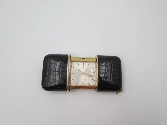 Reloj de viaje Movado Ermetoscope. Chapado en oro y piel cocodrilo. Calendario. 1950