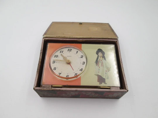 Reloj despertador de sobremesa Seiko Puppet. Forma de libro. Cuerda manual. Japón. 1970