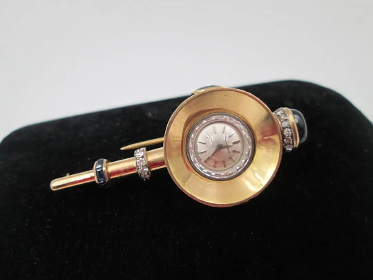 Reloj joya mecánico Movado. Oro 18k, diamantes, zafiros y esmeraldas. 1930