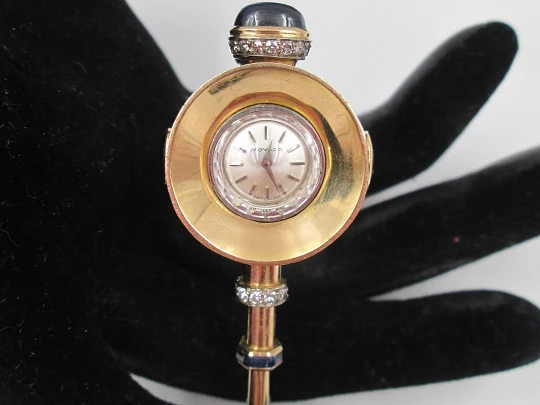 Reloj joya mecánico Movado. Oro 18k, diamantes, zafiros y esmeraldas. 1930