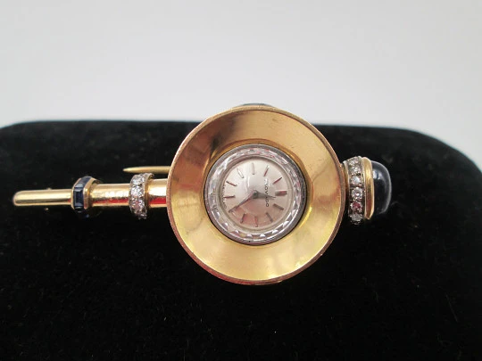 Reloj joya mecánico Movado. Oro 18k, diamantes, zafiros y esmeraldas. 1930