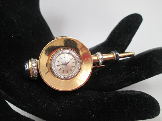 Reloj joya mecánico Movado. Oro 18k, diamantes, zafiros y esmeraldas. 1930