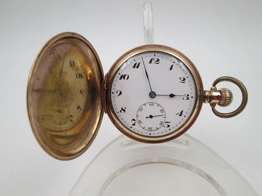 Reloj saboneta Horos. Metal chapado oro. Dial porcelana. Remontoir. Inglaterra / Suiza. 1920