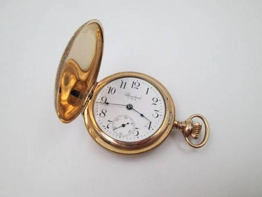 Reloj saboneta Standard. Chapado en oro. Dial porcelana. Cuerda remontoir. 1910. EEUU
