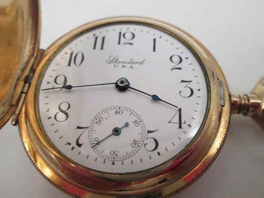Reloj saboneta Standard. Chapado en oro. Dial porcelana. Cuerda remontoir. 1910. EEUU