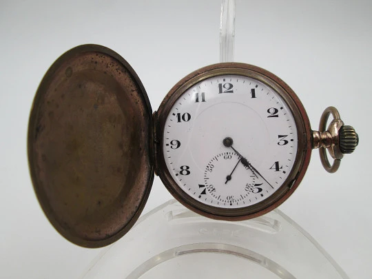 Reloj saboneta. Metal chapado oro. Cuerda remontoir. Dial porcelana. 1940. Suiza