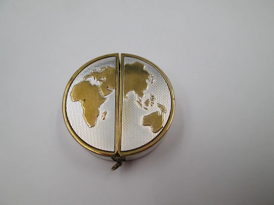 Reloj viaje Mapamundi Poresa. Metal plateado y dorado. Cuerda manual. 1960