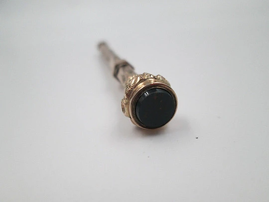 Retractable propelling pencil. Black stone. 10k yellow gold. 1900