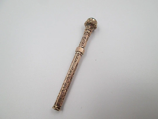 Retractable propelling pencil. Black stone. 10k yellow gold. 1900