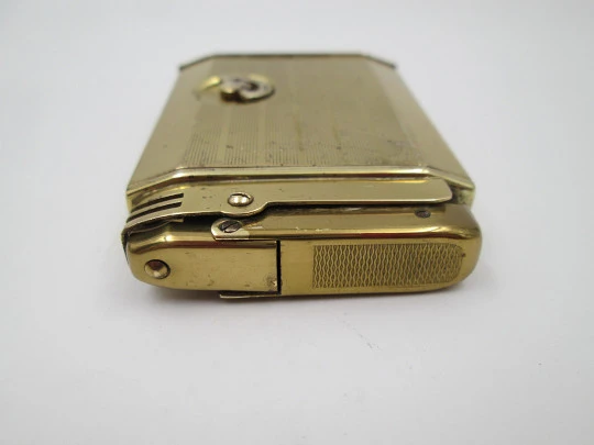 Reuge Slam Song petrol musical lighter. Gold plated. Vertical stripes pattern. Swiss. 1950's