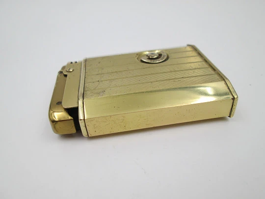 Reuge Slam Song petrol musical lighter. Gold plated. Vertical stripes pattern. Swiss. 1950's