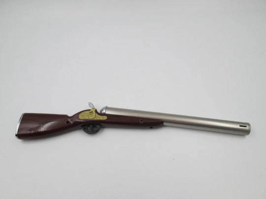 Rifle shape multi-purpose butane lighter. Silver and gold metal. Wood lacquer. 1990's