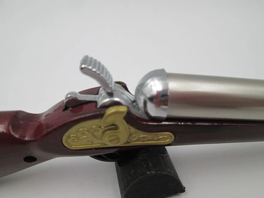 Rifle shape multi-purpose butane lighter. Silver and gold metal. Wood lacquer. 1990's