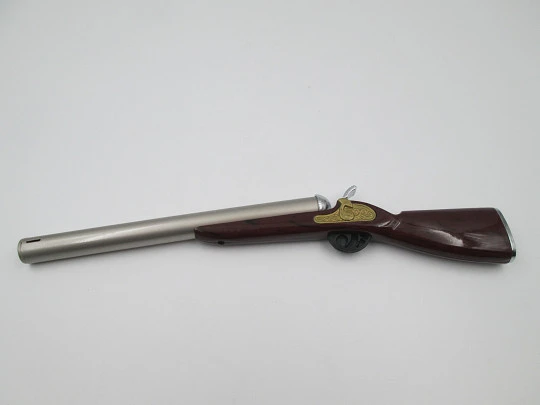 Rifle shape multi-purpose butane lighter. Silver and gold metal. Wood lacquer. 1990's