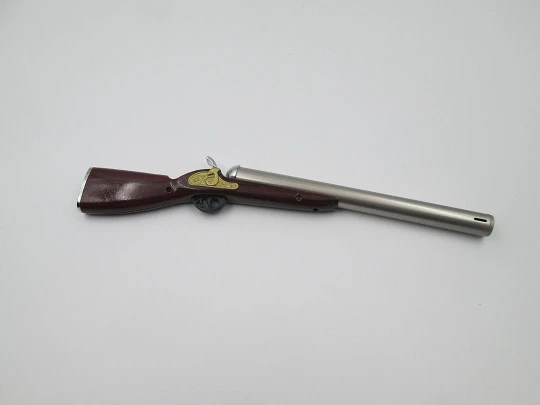 Rifle shape multi-purpose butane lighter. Silver and gold metal. Wood lacquer. 1990's