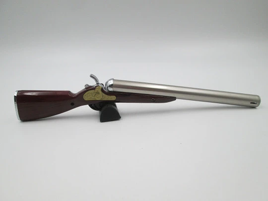 Rifle shape multi-purpose butane lighter. Silver and gold metal. Wood lacquer. 1990's