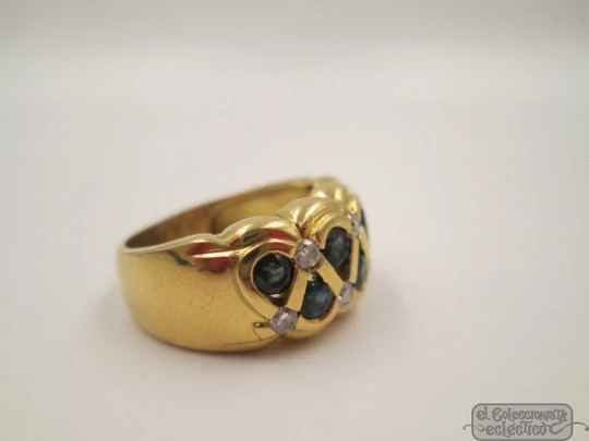 Ring. 18 karat yellow gold. Diamonds and sapphires. 1990's