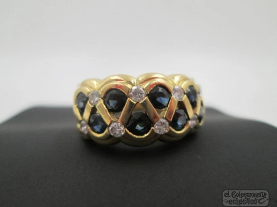 Ring. 18 karat yellow gold. Diamonds and sapphires. 1990's