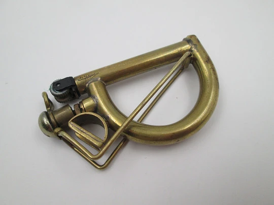 Ritter wick petrol pocket lighter. Gold plated metal. Harp shape. Germany. 1970's Ritter wick petrol pocket lighter. Gold plated metal. Harp shape. Germany. 1970's