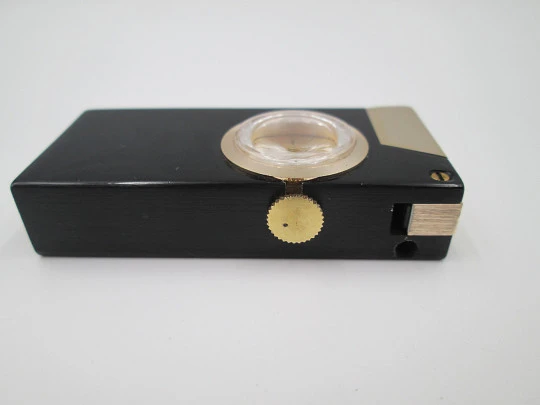 Rivo pocket petrol lighter / mechanical watch. Black lacquer metal & gold plated. 1960's