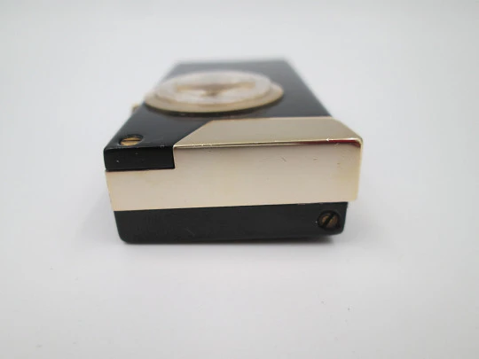 Rivo pocket petrol lighter / mechanical watch. Black lacquer metal & gold plated. 1960's