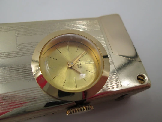 Rivo table petrol lighter / mechanical clock. Gold plated metal. 1960's. Swiss