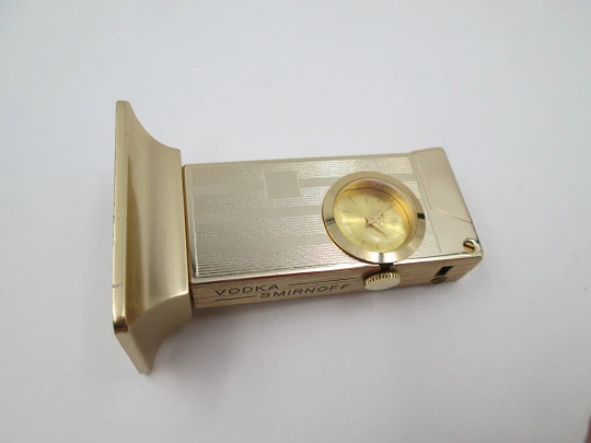 Rivo table petrol lighter / mechanical clock. Gold plated metal. 1960's. Swiss